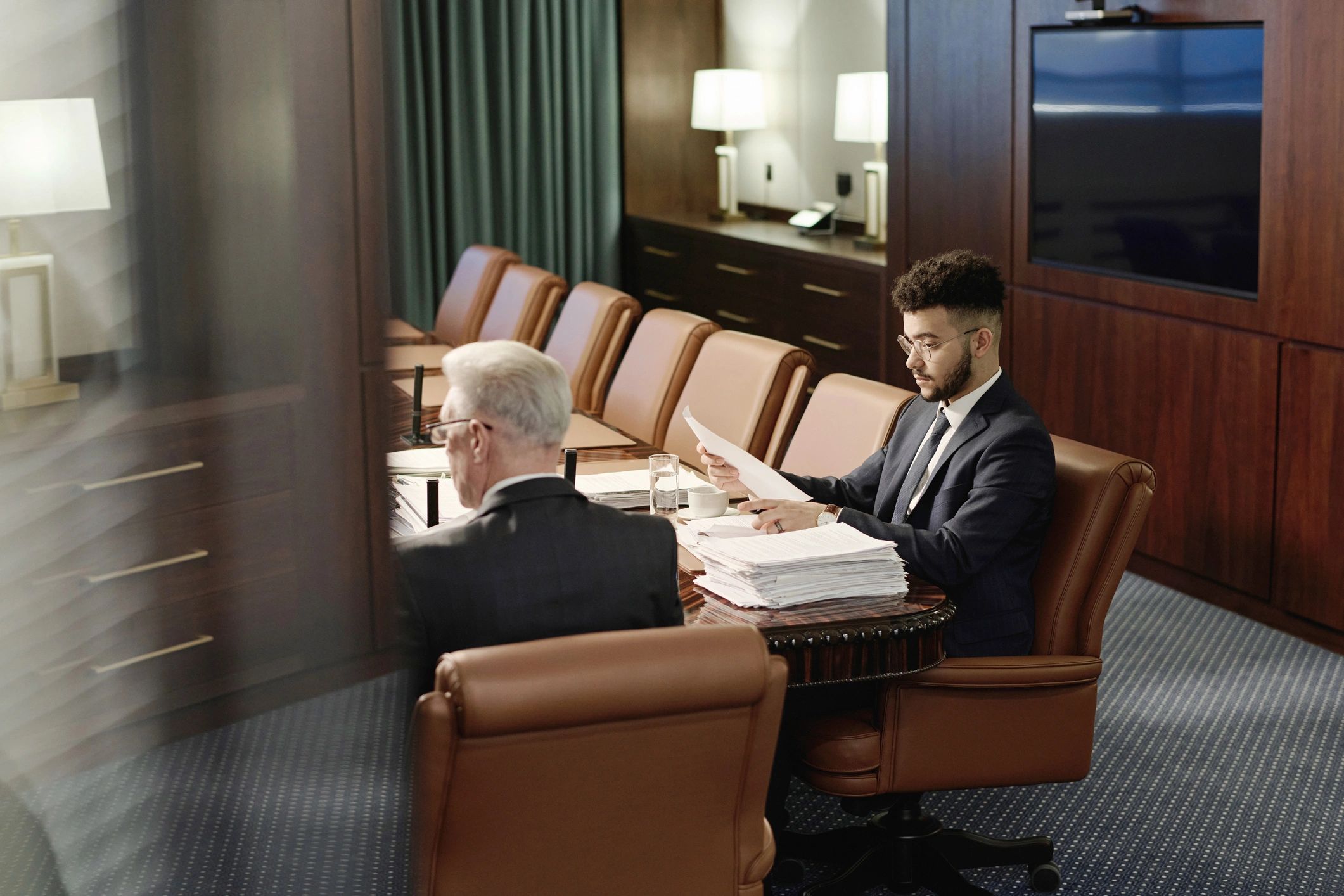 Legal professionals reviewing documents during a proceeding